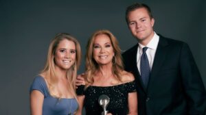 Picture of Kathie Lee Gifford with her two children, Cody and Cassidy Gifford. As Kathie receives an award.