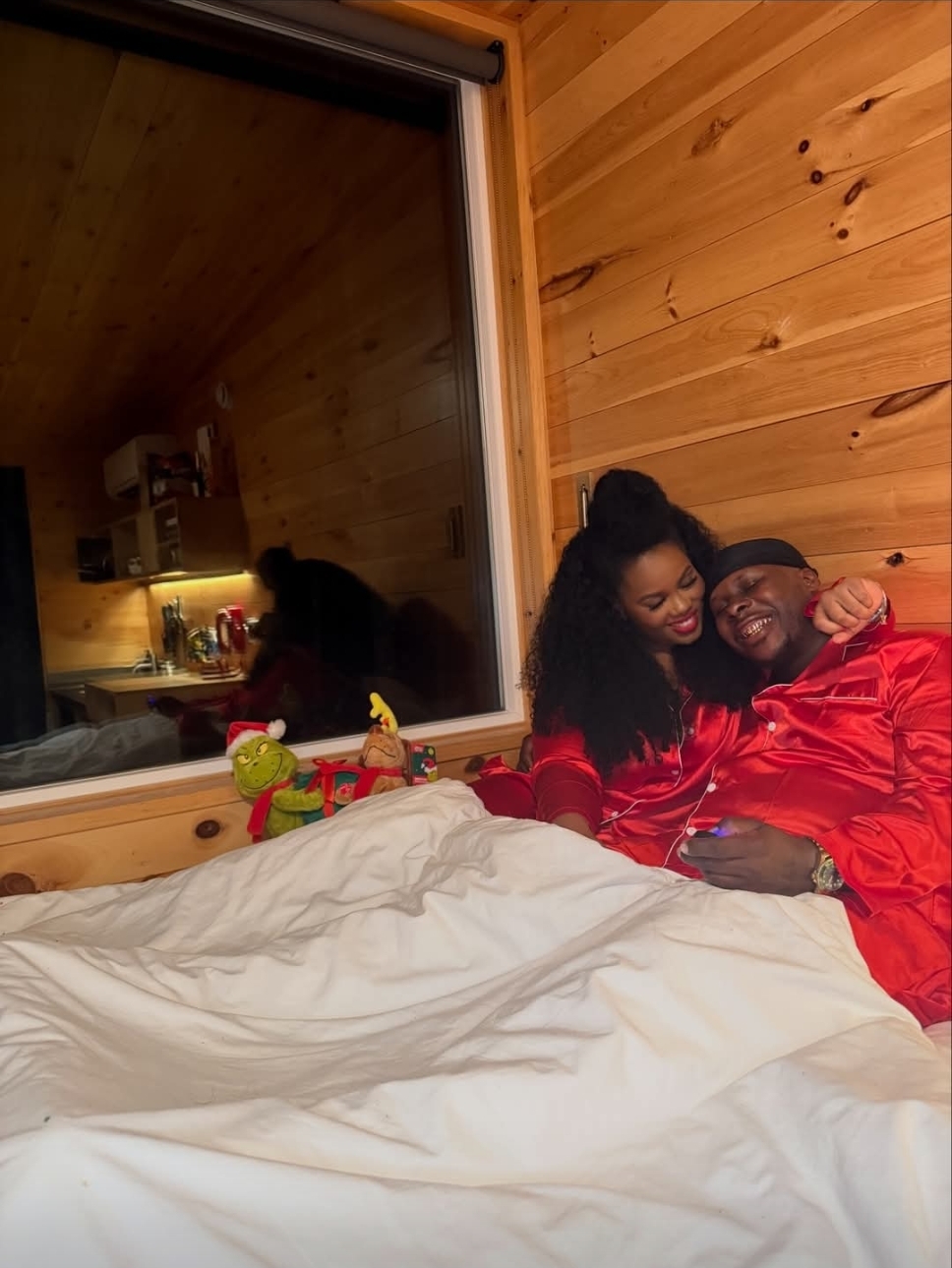 Tyrone Davis Jr. and his girlfriend Lulu pictured together during a Christmas getaway at a cabin.