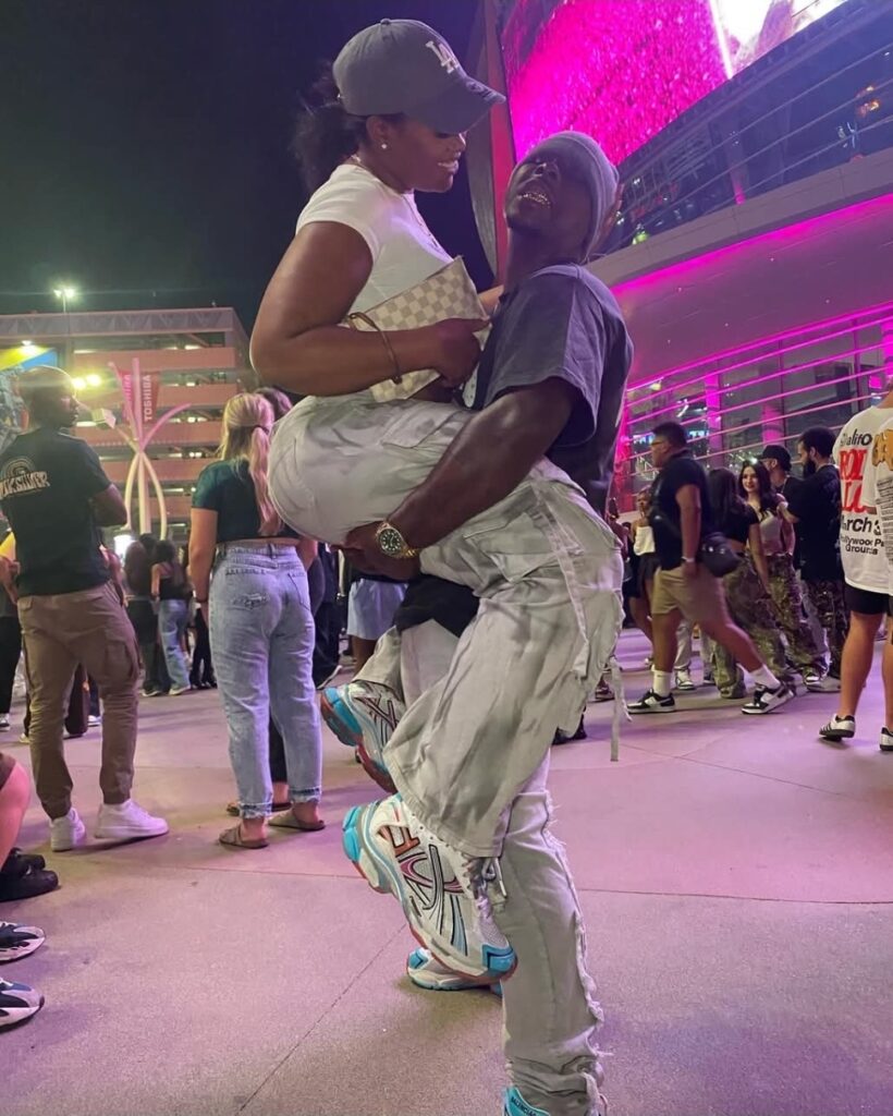 Tyrone Davis Jr and his girlfriend Lulu before his tragic passing. They're pictured on vacation together and he is holding her.